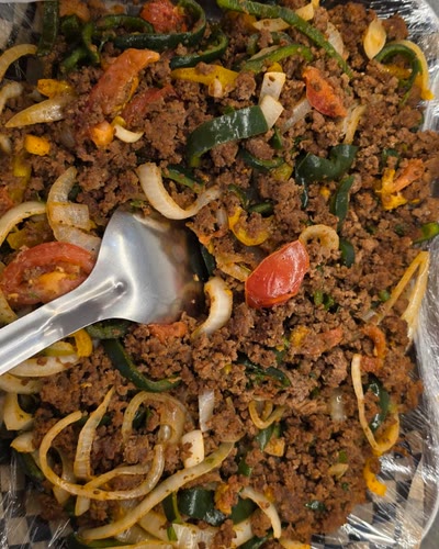 Tray of ground beef sautéed with green peppers, onion and tomato
