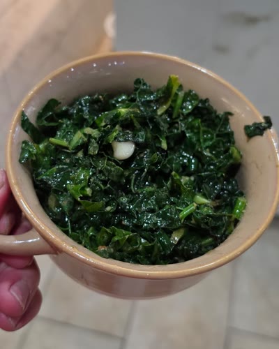 Bowl of collard greens sautéed in garlic