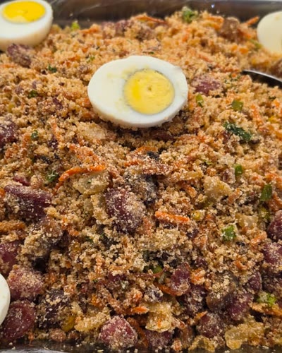 Feijão tropeiro topped with boiled eggs