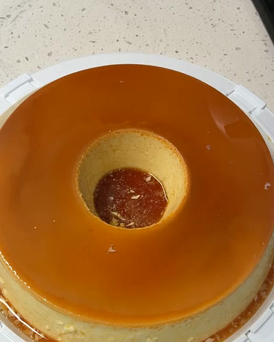 Whole pudim de leite glazed in caramel, seen from above