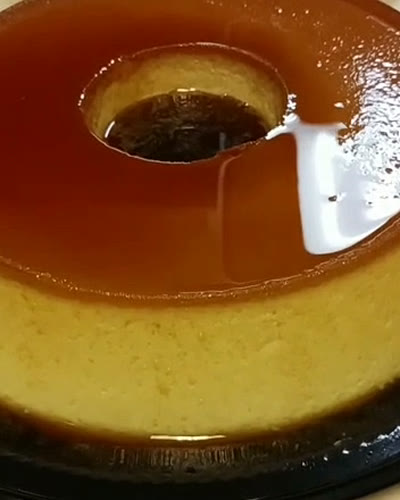 Two pudins de leite with glossy caramel