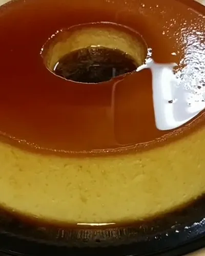 Two pudins de leite with glossy caramel